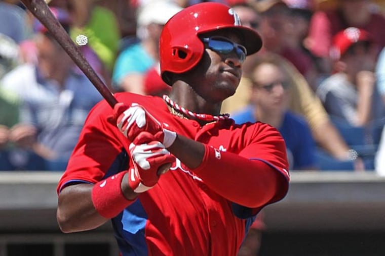 Phillies outfielder Dominic Brown watches his ball leave the yard in
the third inning for a two run homer. (Michael Bryant/Staff Photographer)