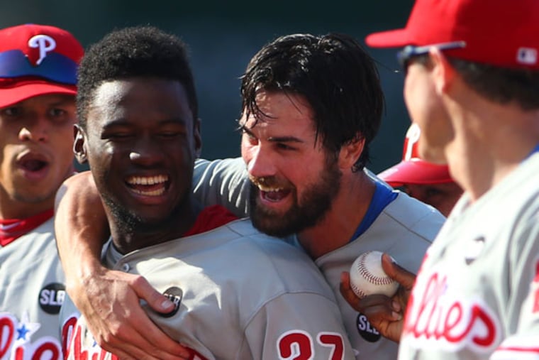 The Phillies' Cole Hamels and Odubel Herrera celebrate after Hamels' no-hit win over the Chicago Cubs, 5-0, at Wrigley Field.