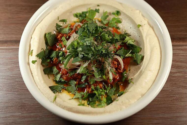 Persian lamb hummus at Dizengoff. (David M Warren/Staff Photographer)