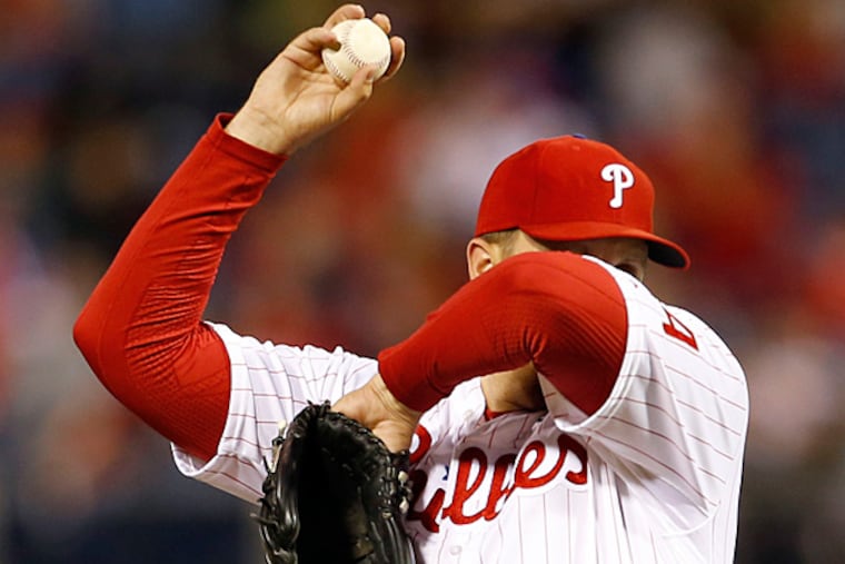 Phillies' pitcher Aaron Harang wipes his face after giving up three
runs in the sixth-inning against the Cincinnati Reds on Thursday, June
4, 2015 in Philadelphia. (Yong Kim/Staff Photographer)