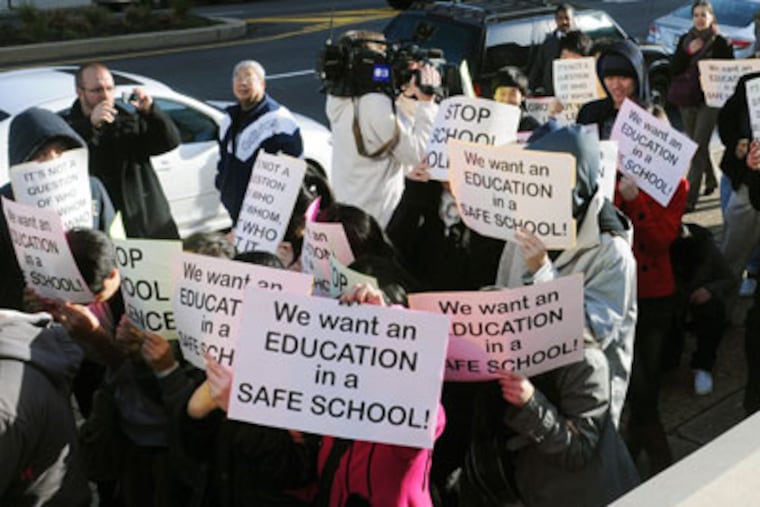 Students and community members walk up Broad Street to protest recent violence at South Philadelphia High School. (Sarah J. Glover / Staff Photographer)