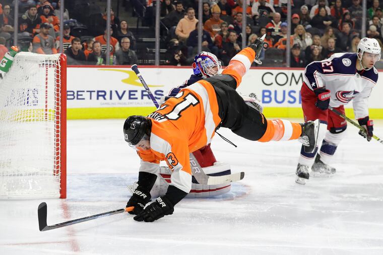 Kevin Hayes fell over Columbus goaltender Joonas Korpisalo during Saturday's rousing win at the Wells Fargo Center.