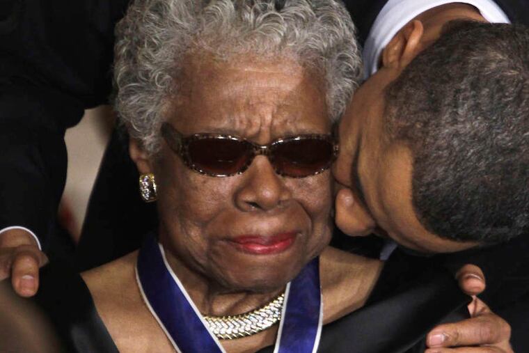 Former President Barack Obama kisses the late Maya Angelou after awarding her the 2010 Medal of Freedom at the White House.