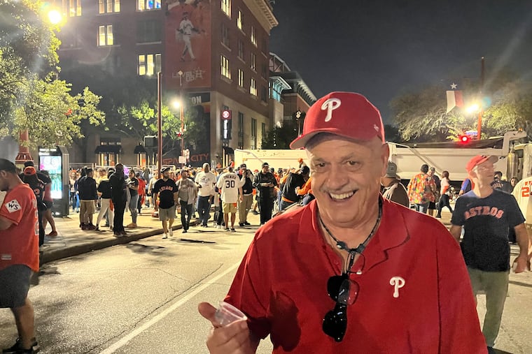 Mike Kern, 62, of Manayunk, tries to make the most of it in Houston after the Phillies World Series loss Saturday night.