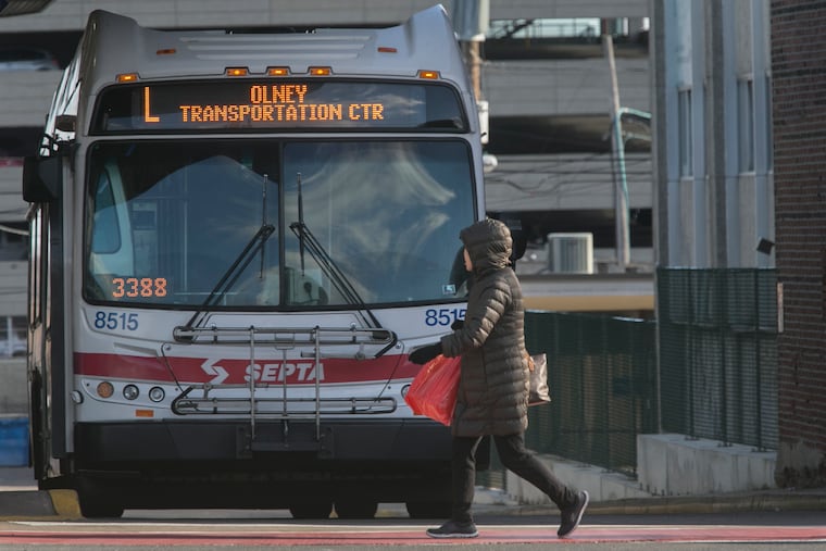 A view of commuters and pedestrians at the SEPTA bus station, Olney terminal N. Broad and Olney, Philadelphia, Christmas afternoon December 25, 2017. Trolleys, buses and trains are an efficient way to move lost of people opting to get out of cars.