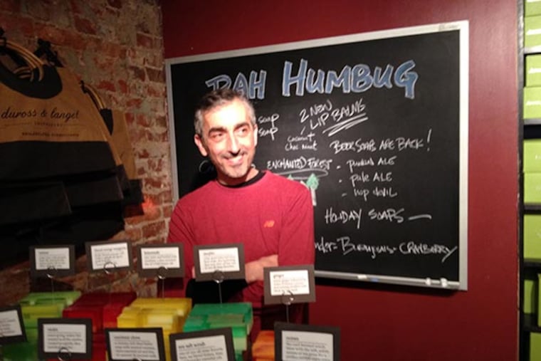 Steve Duross, founder and owner of duross & langel, with some of his natural handmade soaps.
(Michael Hinkelman/Daily News Staff)