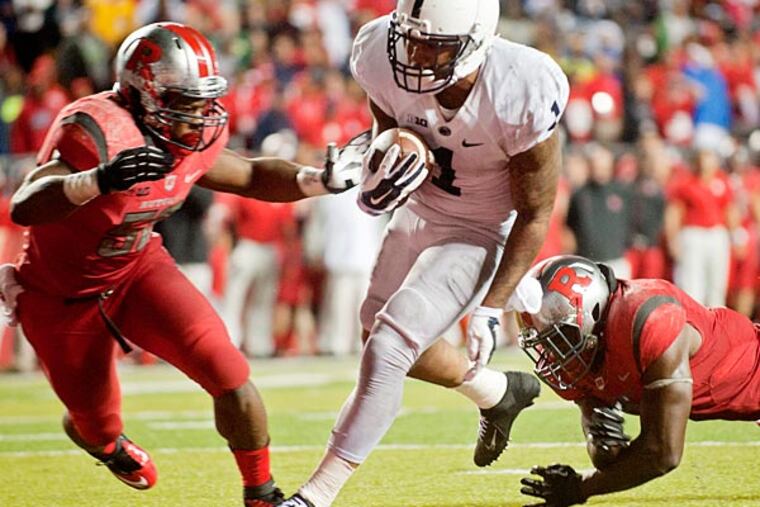 Penn State's Bill Belton runs into the end zone for the winning touchdown past Rutgers defenders during the Saturday, Sept. 13, 2014 game at High Point Solutions Stadium. (AP Photo/Centre Daily Times, Abby Drey)