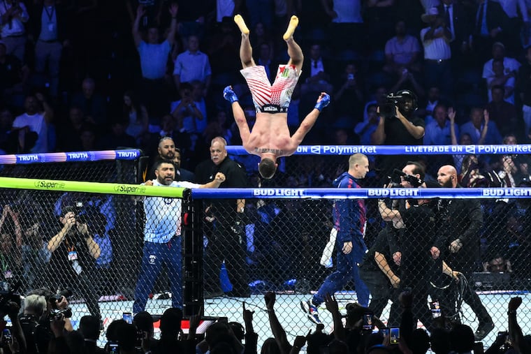 Justin Gaethje does a flip as he celebrates after defeating Ilia Topuria in a lightweight title bout during UFC Freedom 250 on the South Lawn of the White House.