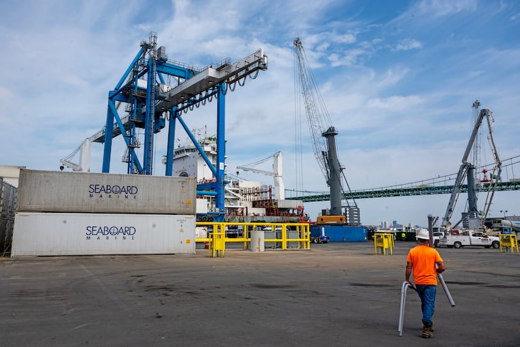Holt Logistics' terminal in Gloucester City faces the company's cranes at PhilaPort across the Delaware River.