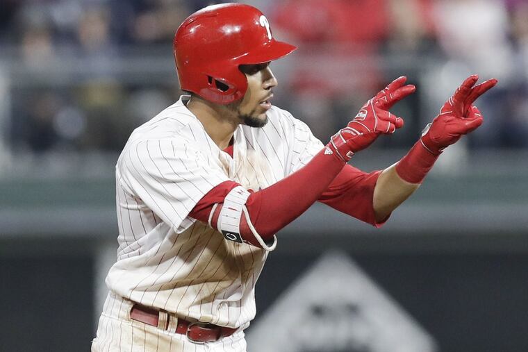 Phillies J.P. Crawford points his fingers after hitting a double against the Braves on April 27.