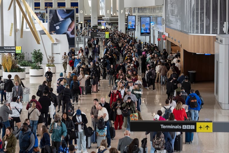 Travelers wait in a TSA line, Wednesday, March 25, 2026, at LaGuardia Airport in New York.