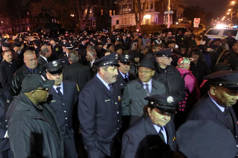 A sea of firefighters and well-wishers in front of Batchelor Brothers funeral home as they wait for the viewing for fallen Philadelphia firefighter Joyce Craig. ( Michael Bryant / Staff Photographer )