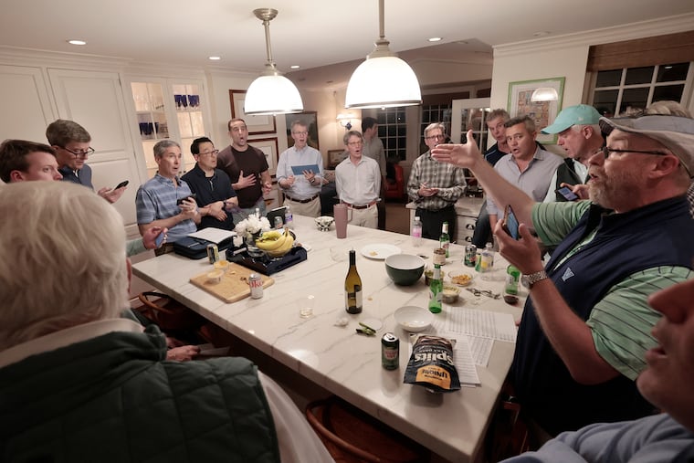The Tonics, a Philly-based men's a capella group whose wholesome performances recently went viral, rehearse on a recent evening in the kitchen of a member's Haverford home.