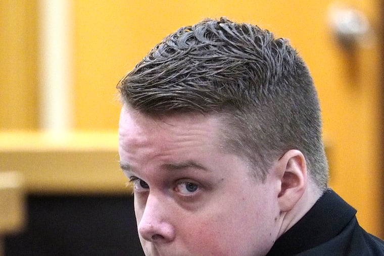 FILE - Defendant Liam McAtasney looks toward the gallery where his family is seated Tuesday, Feb. 5, 2019, during his murder trial at the Monmouth County courthouse in Freehold, N.J.
