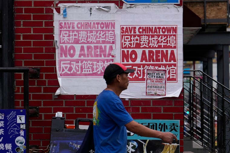 A man walks through the Chinatown neighborhood of Philadelphia. Mayor Cherelle L. Parker announced last week that she supports an arena being built next to the Center City neighborhood.