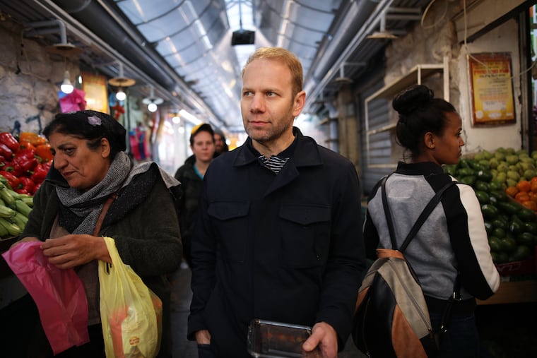 Steven Cook walks through Mahane Yehuda Market in Jerusalem, Israel, February 14, 2019.