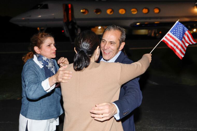 Family members embrace freed American Emad Shargi after he arrived at Davison Army Airfield on Tuesday, Sept. 19, 2023 at Fort Belvoir, Va. Shargi and four fellow detainees were released in a prisoner swap deal between the U.S and Iran.