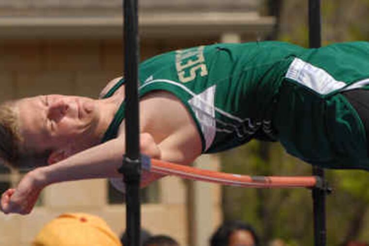Seneca's Drew Kanz clears the bar at 6 feet, 4 inches to finish third in the high jump during the open-event portion of the Woodbury Relays.