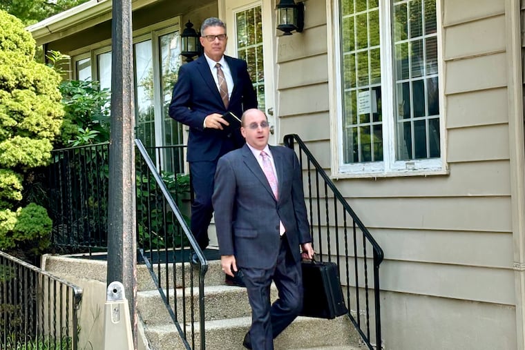 Tim Boyce, the former Delaware County Director of Emergency Services (rear) walks out of district court in Lima with his attorney, Andrew Edelberg in August.
