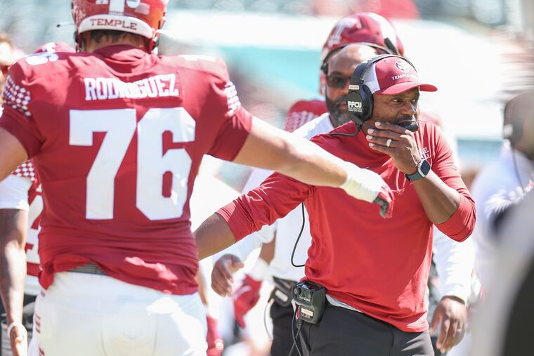 Temple Owls head coach Stan Drayton right, had plenty of high-fives to dish out following a commanding Owls win over Utah State at Lincoln Financial Field on Saturday.