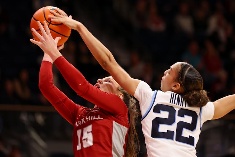 Villanova's Kennedy Henry blocks a shot by Gabby Casey of St. Joe's during the second quarter Sunday.
