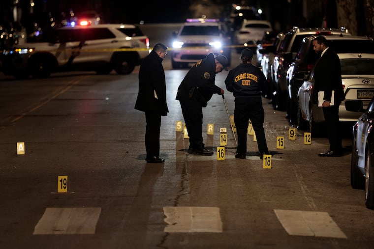 Police gather evidence at the crime scene in the 7100 block of north 19th Street in Philadelphia on Tuesday, April 7, 2026. Around 8:45 pm a 13 year old was shot and killed and a 14 year old was critically injured at that scene.