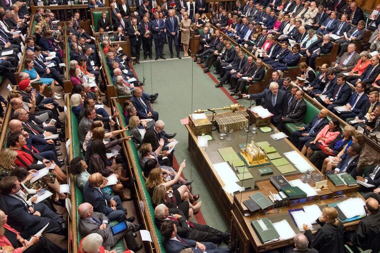 In this handout photo provided by the House of Commons, Britain's Prime Minister Boris Johnson (center right) gestures during his first Prime Minister's Questions, in the House of Commons in London, Wednesday, Sept. 4, 2019. Britain's Parliament is facing a second straight day of political turmoil as lawmakers fought Johnson's plan to deliver Brexit in less than two months.