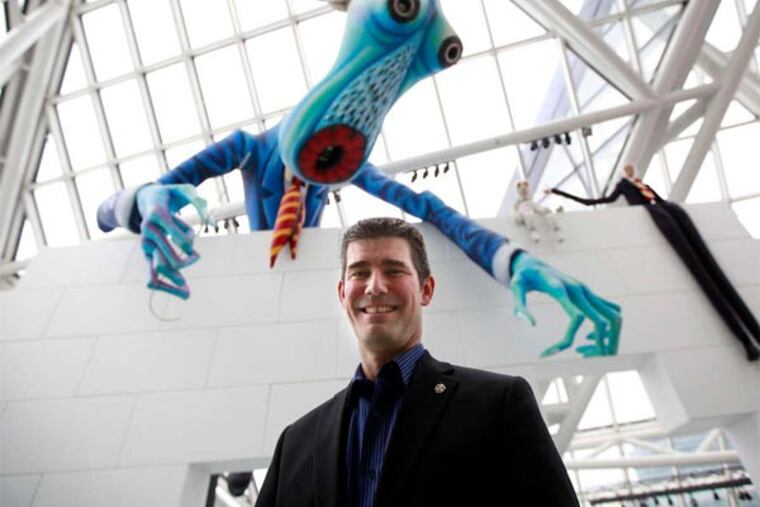 Bucks native Greg Harris, named CEO in December, at the Rock and Roll Hall with Pink Floyd creatures.