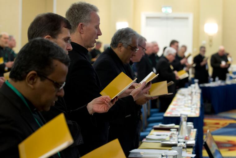 Catholic bishops participate in a morning prayer during the U.S. Conference of Catholic Bishops' spring assembly Tuesday in Baltimore.