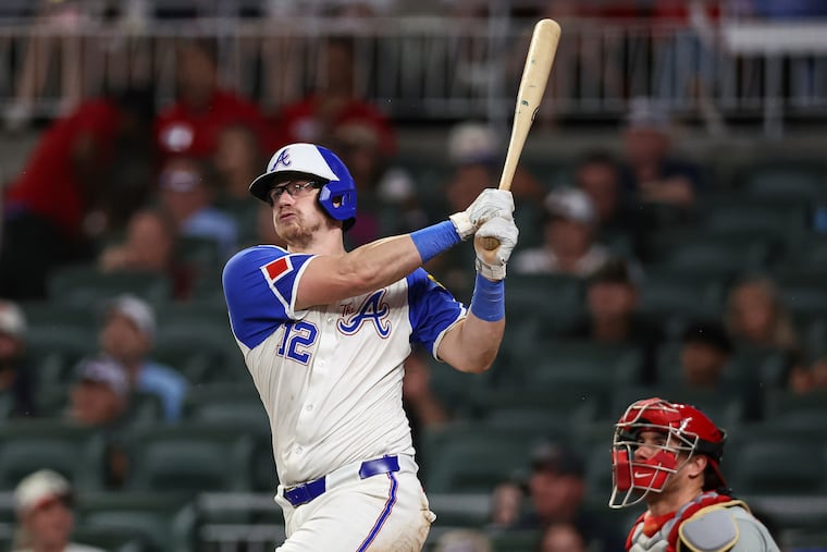 Atlanta Braves' Sean Murphy (12) hits a grand slam in the seventh inning of a baseball game against the Philadelphia Phillies, Saturday, June 28, 2025, in Atlanta. (AP Photo/Colin Hubbard)