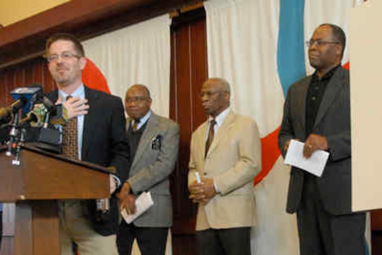 The Rev. Jeffrey Vamos of the Presbyterian Church of Lawrenceville speaks to reporters about the missionaries. With him (from left) are Deacon Emeritus Ollie Green, Deacon George Poole, and the Rev. Archie McBride of Shiloh Baptist Church of Trenton.