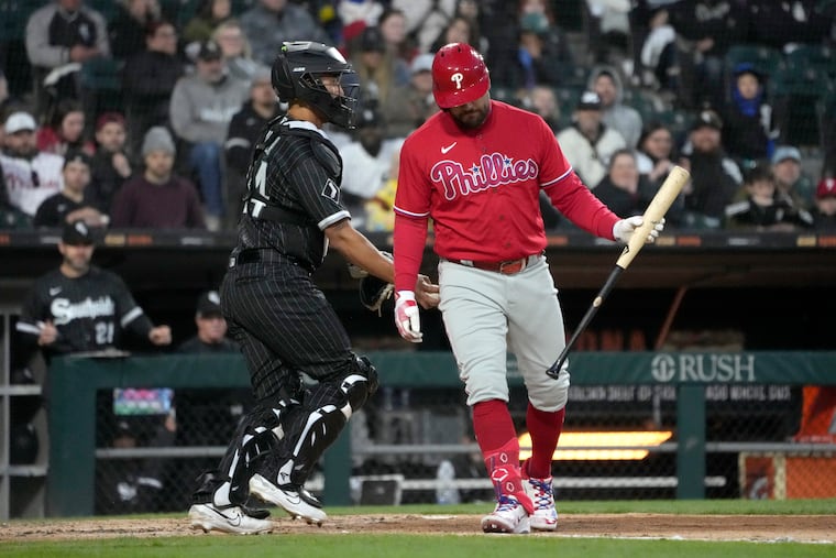 White Sox catcher Seby Zavala tags out Kyle Schwarber after a dropped third strike in the second game of a doubleheader on Tuesday in Chicago.