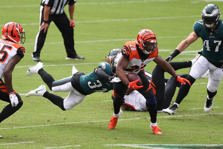 Eagles cornerback Nickell Robey-Coleman dives after Cincinnati Bengals running back Joe Mixon during the first quarter on Sunday.