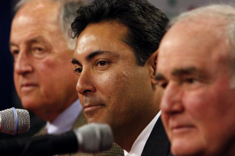 Lame-duck general manager Ruben Amaro Jr. is flanked by Pat Gillick (left) and David Montgomery. (Joseph Kaczmarek/Associated Press)