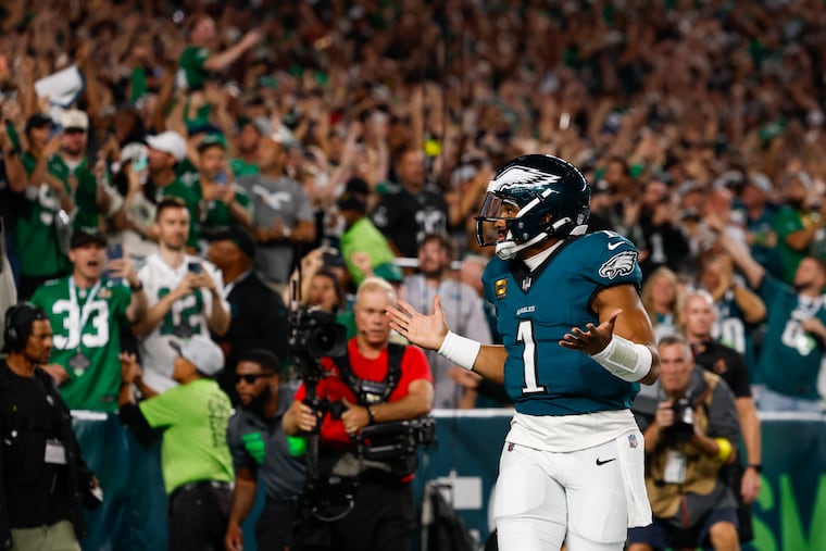 Eagles quarterback Jalen Hurts celebrates after scoring a touchdown during the first quarter against the Cowboys.