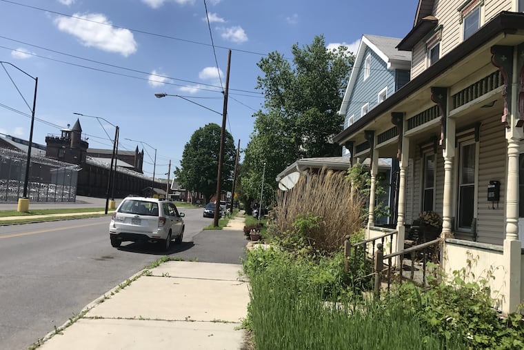 In Smithfield, Pa., front porches look out over the barbed wire of SCI Huntingdon.