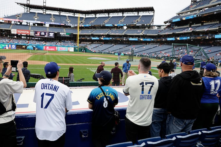 Los Angeles Dodgers designated hitter Shohei Ohtani fans watch the Dodger take batting practice before the Phillies play the Dodgers on April 4.