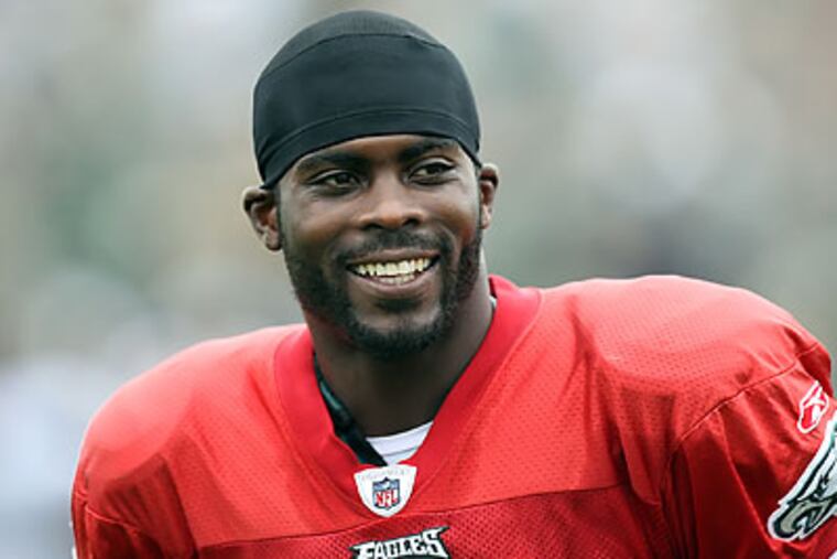 Michael Vick has gone from afterthought backup to draw for free agents from other teams. (Steven M. Falk/Staff Photographer)