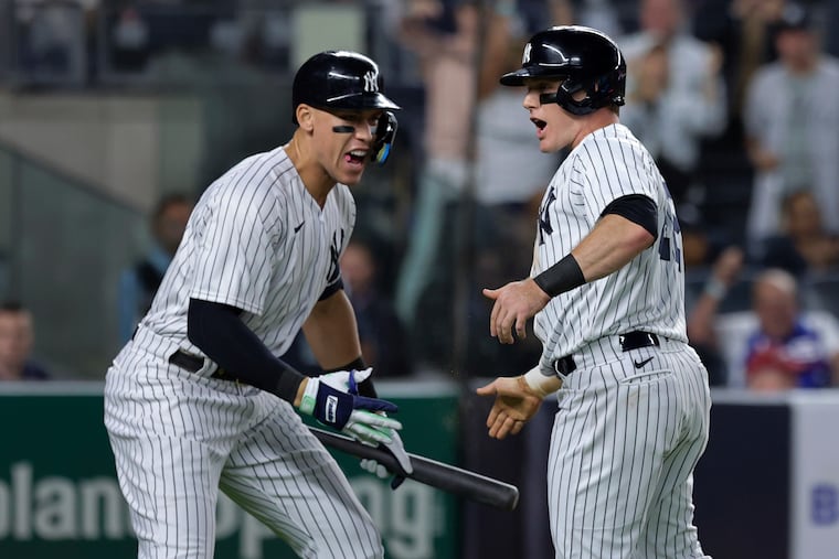New York Yankees' Harrison Bader celebrates Aaron Judge after scoring against the Pittsburgh Pirates during the fifth inning of a baseball game Tuesday, Sept. 20, 2022, in New York.