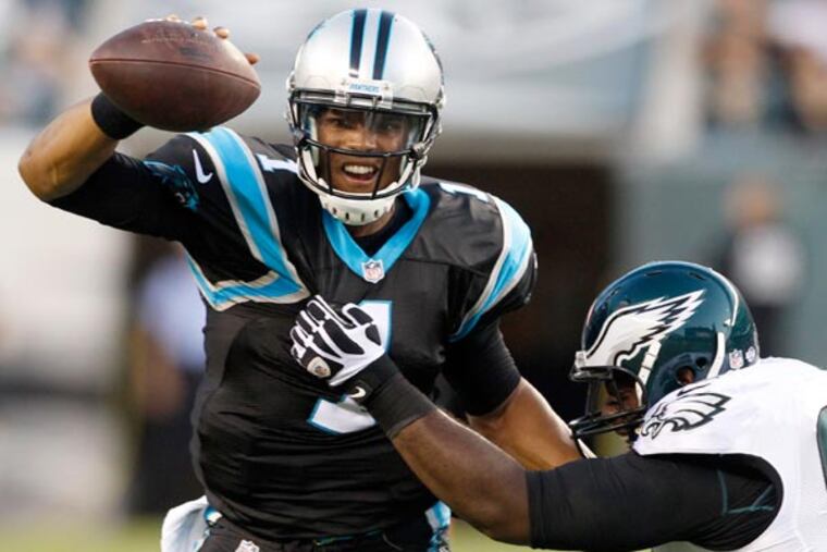 Fletcher Cox tackling Panthers quarterback Cam Newton. (Ron Cortes/Staff Photographer)