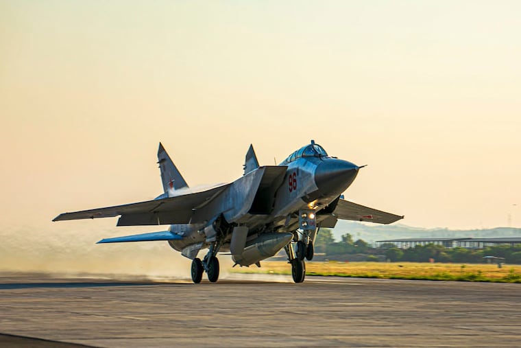 In this photo released by Russian Defense Ministry Press Service, a Russian MiG-31 fighter jet carrying a Kinzhal missile takes off from the Hemeimeem air base in Syria on June 25, 2021.