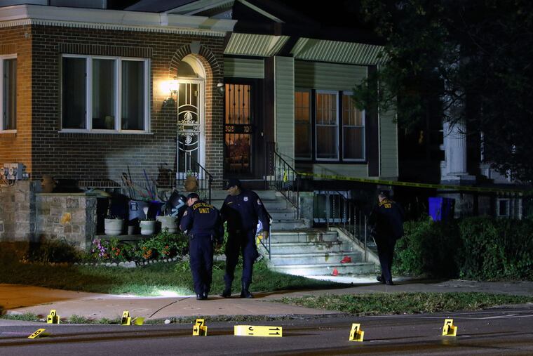 Investigators process the crime scene on the 700 block of Cobbs Creek Parkway on Wednesday, Sept. 28, 2016, in West Philadelphia.
