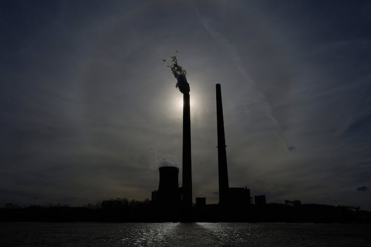 The Mountaineer Power Plant, a coal-fired power plant near New Haven, W.Va., is seen across the Ohio River from Racine, Ohio, on March 13.