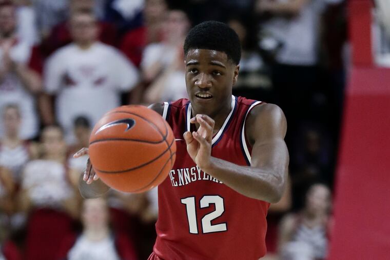 Penn guard Devon Goodman passes the ball during the Quakers' win over St. Joseph's.