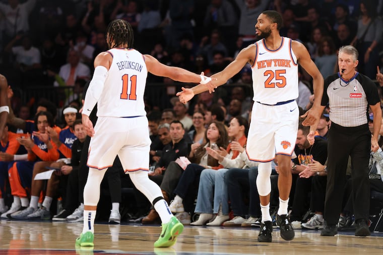Jalen Brunson congratulates Mikal Bridges during a preseason against the Minnesota Timberwolves last month. The former Villanova stars now help power the New York Knicks.