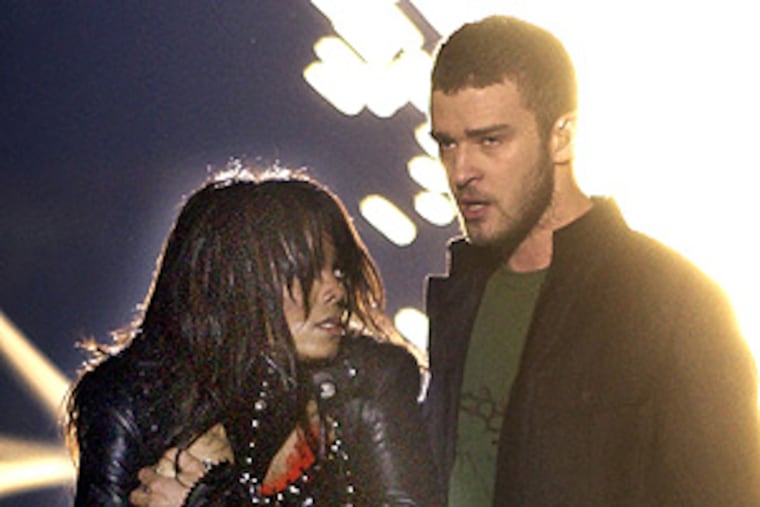Singer Janet Jackson covers her breast after her
outfit came undone during a number with Justin Timberlake during the
halftime show of Super Bowl XXXVIII in Houston on Feb. 1, 2004.
