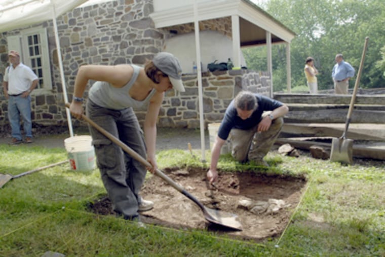 Temple University graduate students Katie Cavallo and Joe Blondino do an archaelogical dig, searching for Gen. George Washington's original dining room, at Valley Forge National Park. (April Saul / Staff Photographer)