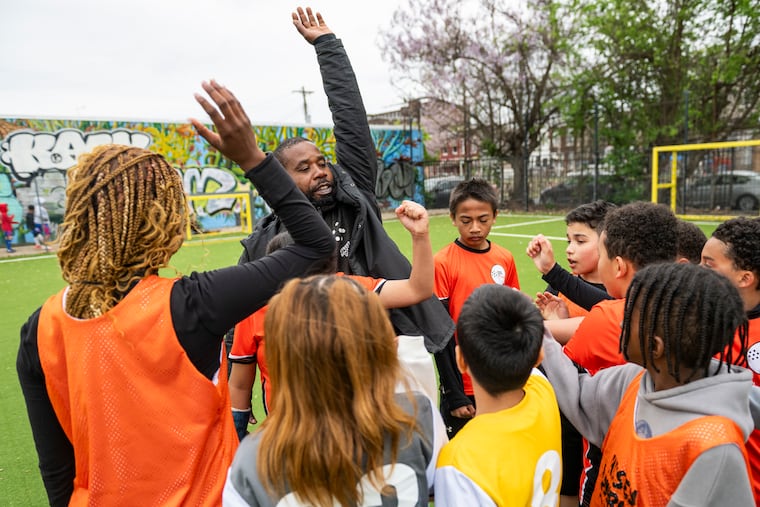 Tsega McDermott, director of Street Soccer USA in Philadelphia, coaches a community team at the first Love Street League program at Hissey Playground earlier this year. The program is a community league supported by Philadelphia Mayor’s office.
