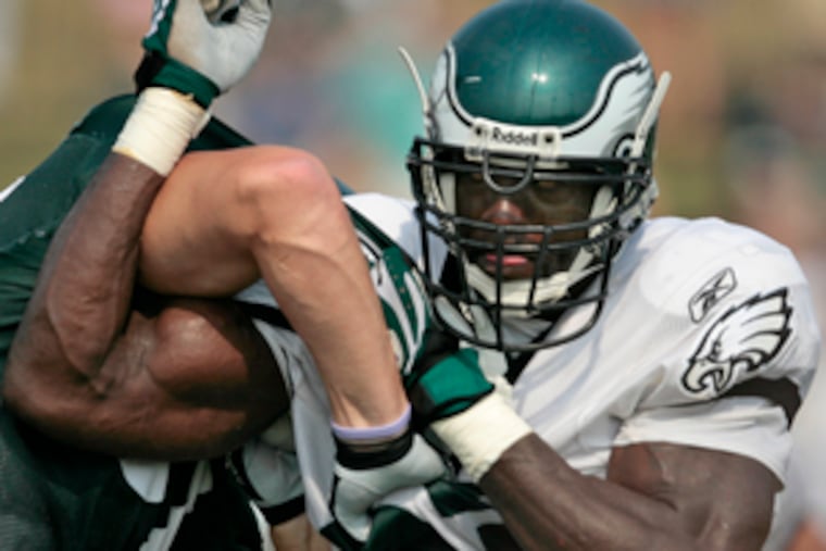 Jevon Kearse, back from injury, works to free himself at camp.