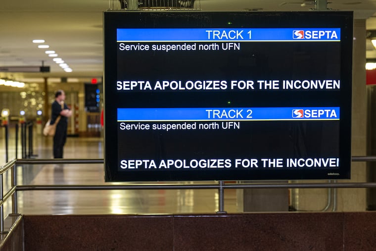 A sign apologizes for train service disruptions at Suburban Station on Wednesday, July 1, 2026, in Philadelphia. Rail service was suspended and delayed during the early morning hours following a train derailment.